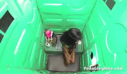 Insatiable ebony teen sucks white wiener through a gloryhole