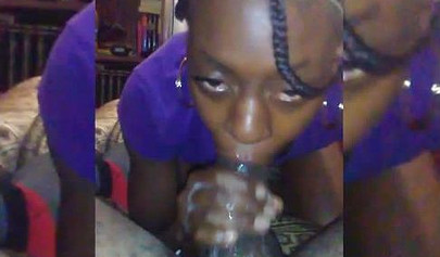 Afro-American nympho blowing a massive meat pole