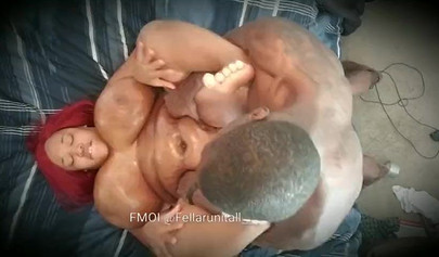 Redheaded ebony BBW enjoying rough missionary sex