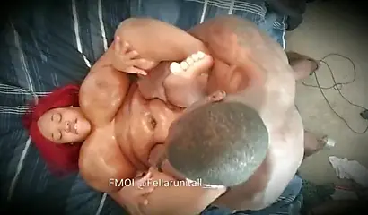 Redheaded ebony BBW enjoying rough missionary sex