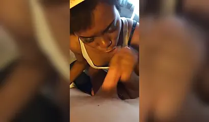 Cute Afro-American babe sucking my white dick in POV