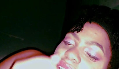 Busty ebony on her side giving a mind-blowing BJ