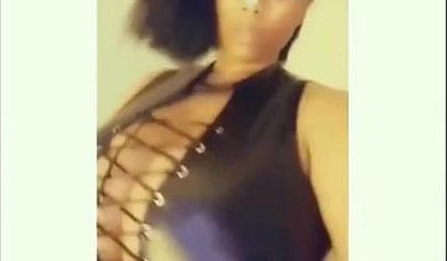 Sexy ebony goddess teases with her curves in a solo