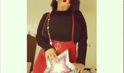 Sexy ebony goddess teases with her curves in a solo