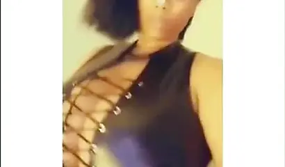 Sexy ebony goddess teases with her curves in a solo