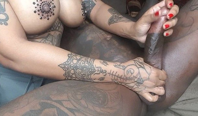 Busty tattooed ebony milks and sucks a huge black dick