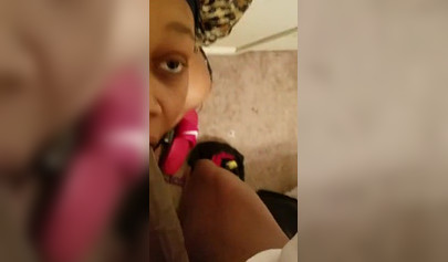 Black sweetie swallowing a giant ebony rod