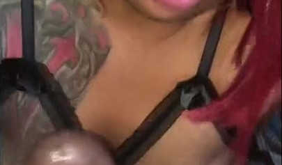 Redheaded ebony slut Caramel Chaun shows off her cock sucking skills