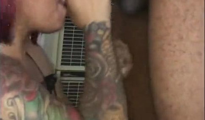 Redheaded ebony slut Caramel Chaun shows off her cock sucking skills