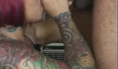 Redheaded ebony slut Caramel Chaun shows off her cock sucking skills