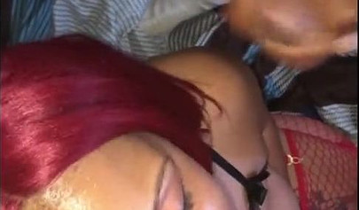 Redheaded ebony slut Caramel Chaun shows off her cock sucking skills