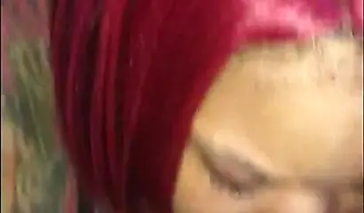 Redheaded ebony slut Caramel Chaun shows off her cock sucking skills