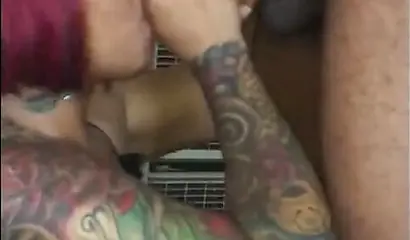 Redheaded ebony slut Caramel Chaun shows off her cock sucking skills