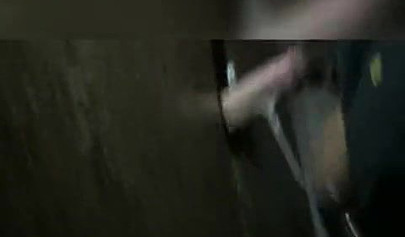 Nasty ebony slut blows a white dick through a gloryhole