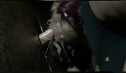 Nasty ebony slut blows a white dick through a gloryhole