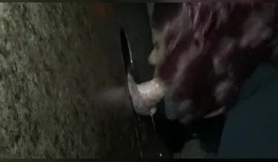 Nasty ebony slut blows a white dick through a gloryhole