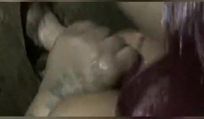 Nasty ebony slut blows a white dick through a gloryhole