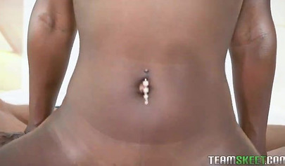 Cute ebony Anne Amari sits on a white rod & rides it