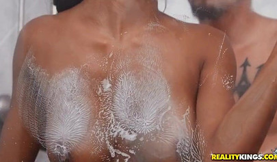 Busty ebony Nia Nacci gets fucked by her stepbro in the shower