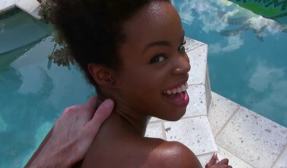 Slender ebony Mila Dulce dominates a white cock poolside