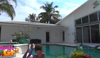 Ebony model Mila Dulce strips poolside and gives a BJ