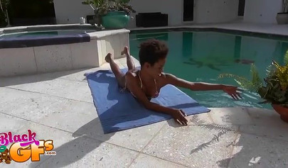 Ebony model Mila Dulce strips poolside and gives a BJ