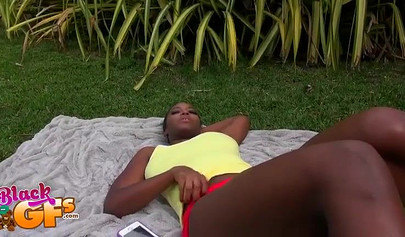 Black beauty Eva Quinn blows a white dick while sunbathing