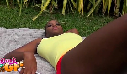 Black beauty Eva Quinn blows a white dick while sunbathing