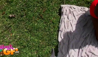 Black beauty Eva Quinn blows a white dick while sunbathing