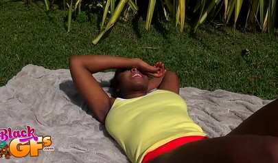 Black beauty Eva Quinn blows a white dick while sunbathing