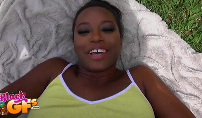 Black beauty Eva Quinn blows a white dick while sunbathing