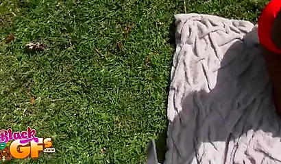 Black beauty Eva Quinn blows a white dick while sunbathing