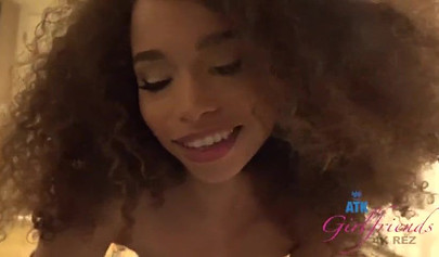 Hot ebony smiles while using her feet on his cock