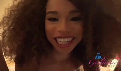 Hot ebony smiles while using her feet on his cock