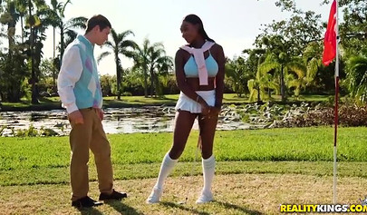 Desirable Tyler Steel teases with a sexy outfit on a golf course before sucking