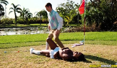 Desirable Tyler Steel teases with a sexy outfit on a golf course before sucking