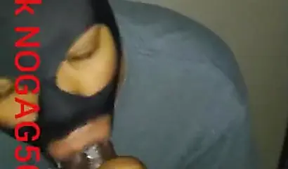 Masked amateur wraps her lips around a big black cock