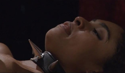 Luna Corazon is bound while shafted by a stiff pole