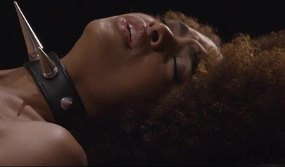 Luna Corazon is bound while shafted by a stiff pole