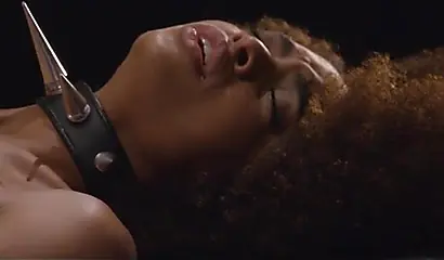 Luna Corazon is bound while shafted by a stiff pole