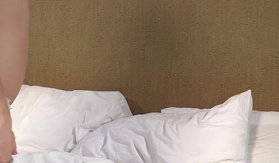 Mary shows off her perfect figure while posing on bed