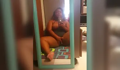 Chubby black beauty records herself while fingering her slit on camera