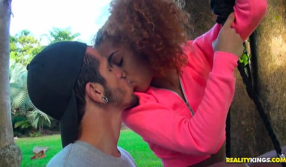 Desirable black chick Kendall Woods gives a blowjob outdoors