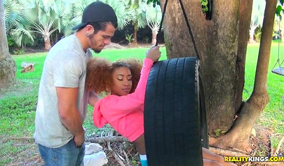 Desirable black chick Kendall Woods gives a blowjob outdoors