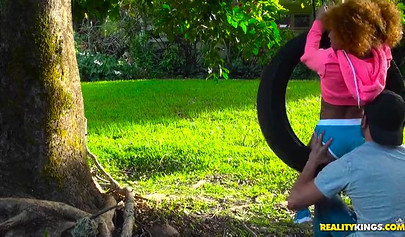 Desirable black chick Kendall Woods gives a blowjob outdoors