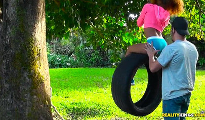 Desirable black chick Kendall Woods gives a blowjob outdoors