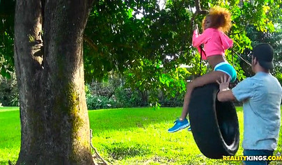 Desirable black chick Kendall Woods gives a blowjob outdoors