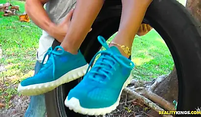 Desirable black chick Kendall Woods gives a blowjob outdoors