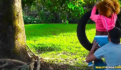 Desirable black chick Kendall Woods gives a blowjob outdoors