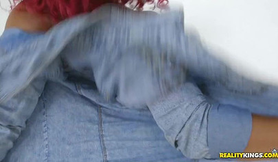 Kinky black babe Dani Dolce shows off her oiled body in a red bikini